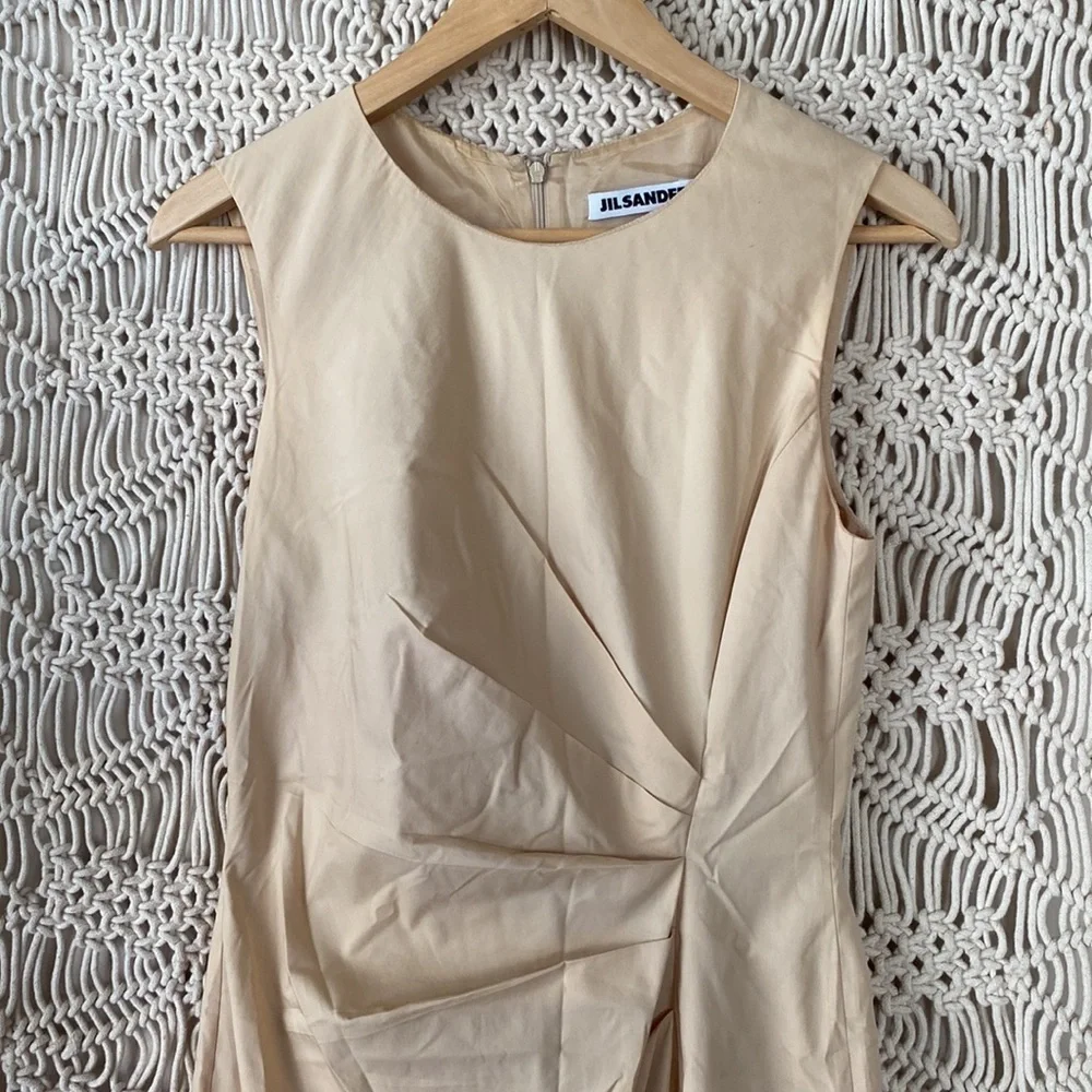 Jil Sander Designer midi dress in a eggshell cream color, fitted cockta…
